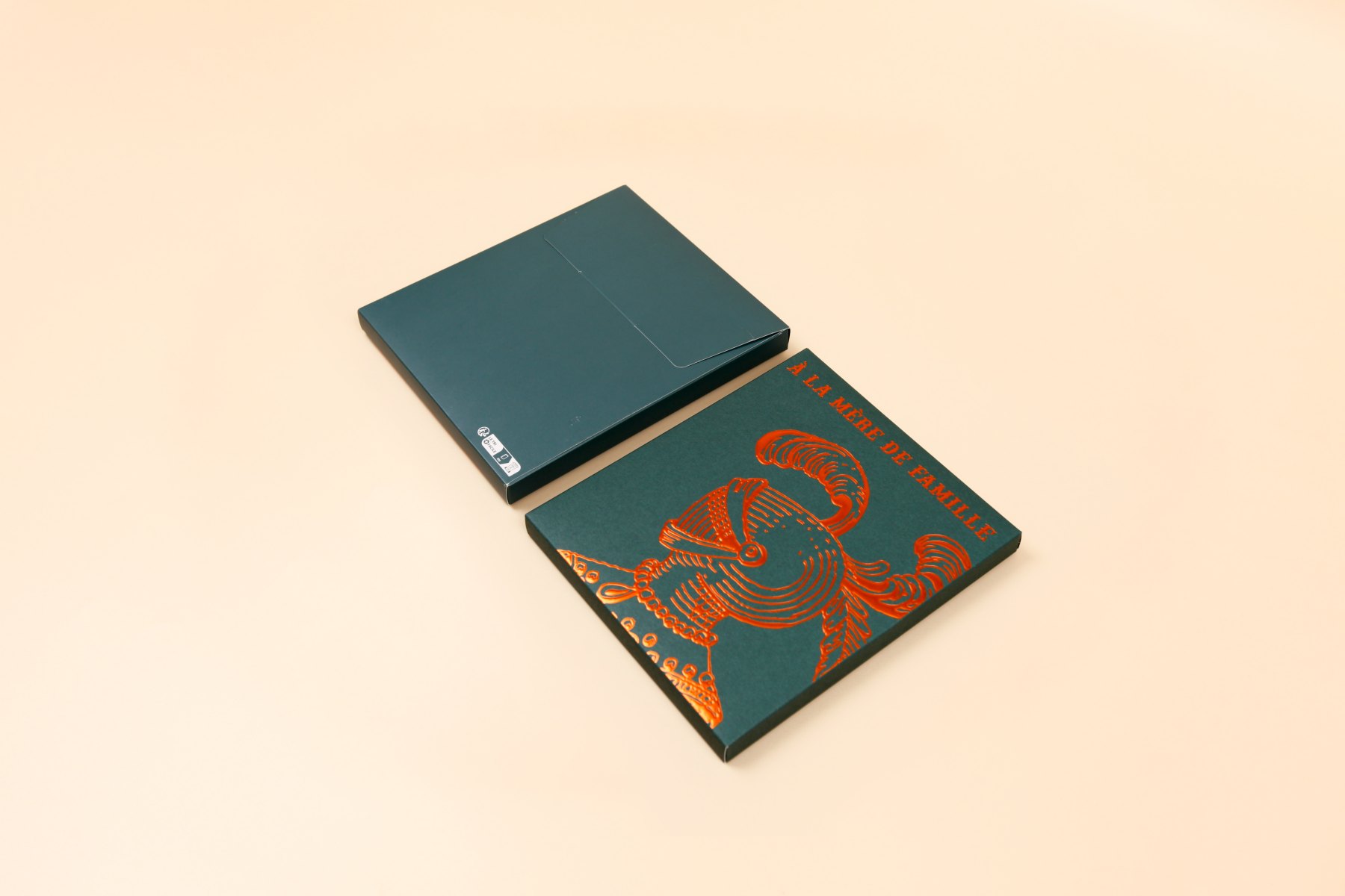 Book-style rigid box in dark green